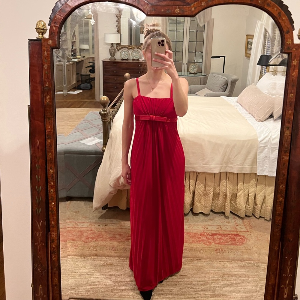 Red Pleated Sleeveless Gown with Empire Waist and Satin Bow